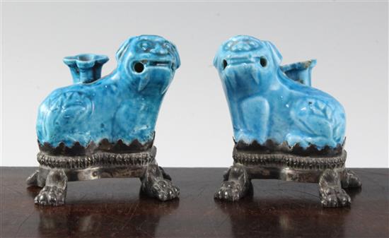 A pair of Chinese blue glazed biscuit porcelain lion-dog incense stick holders, 18th century, height 7.5cm, one nozzle glued